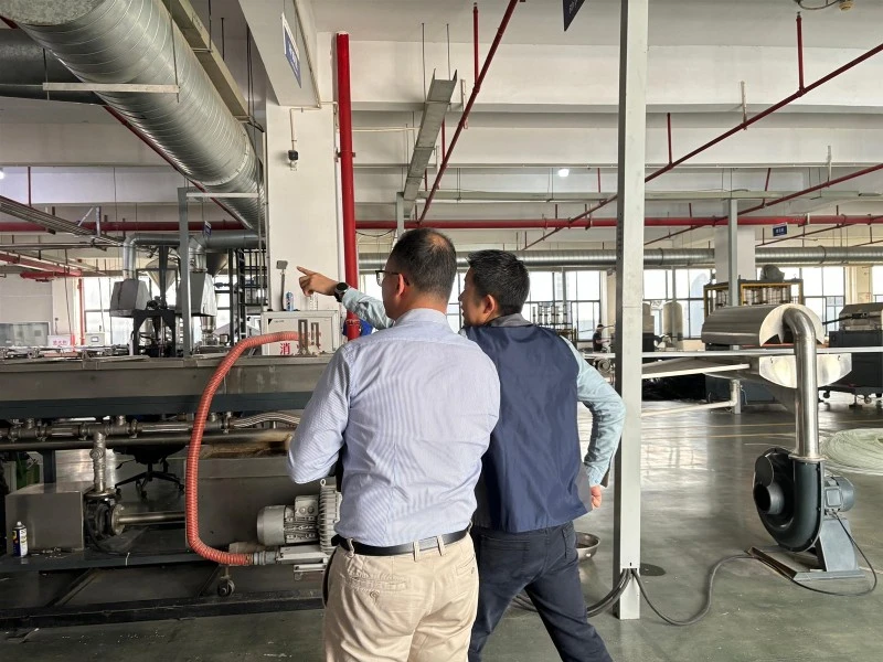 LFT-G engineers explaining the production line to Middle East visitors LFT-G engineers explaining the production line to Middle East visitors